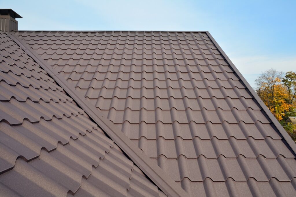what are the most durable roofing materials Metal Roof Construction Against Blue Sky. Roofing materials. Metal House roof. Closeup House Construction Building Materials. Roof construction. 
